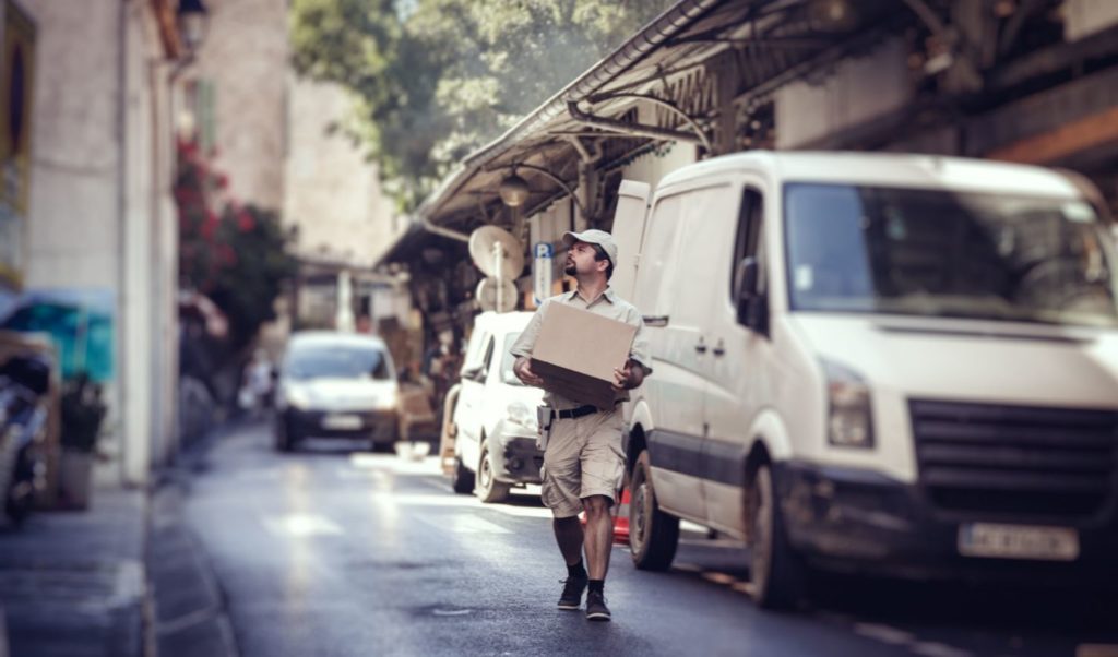 Courier worker carrying box.