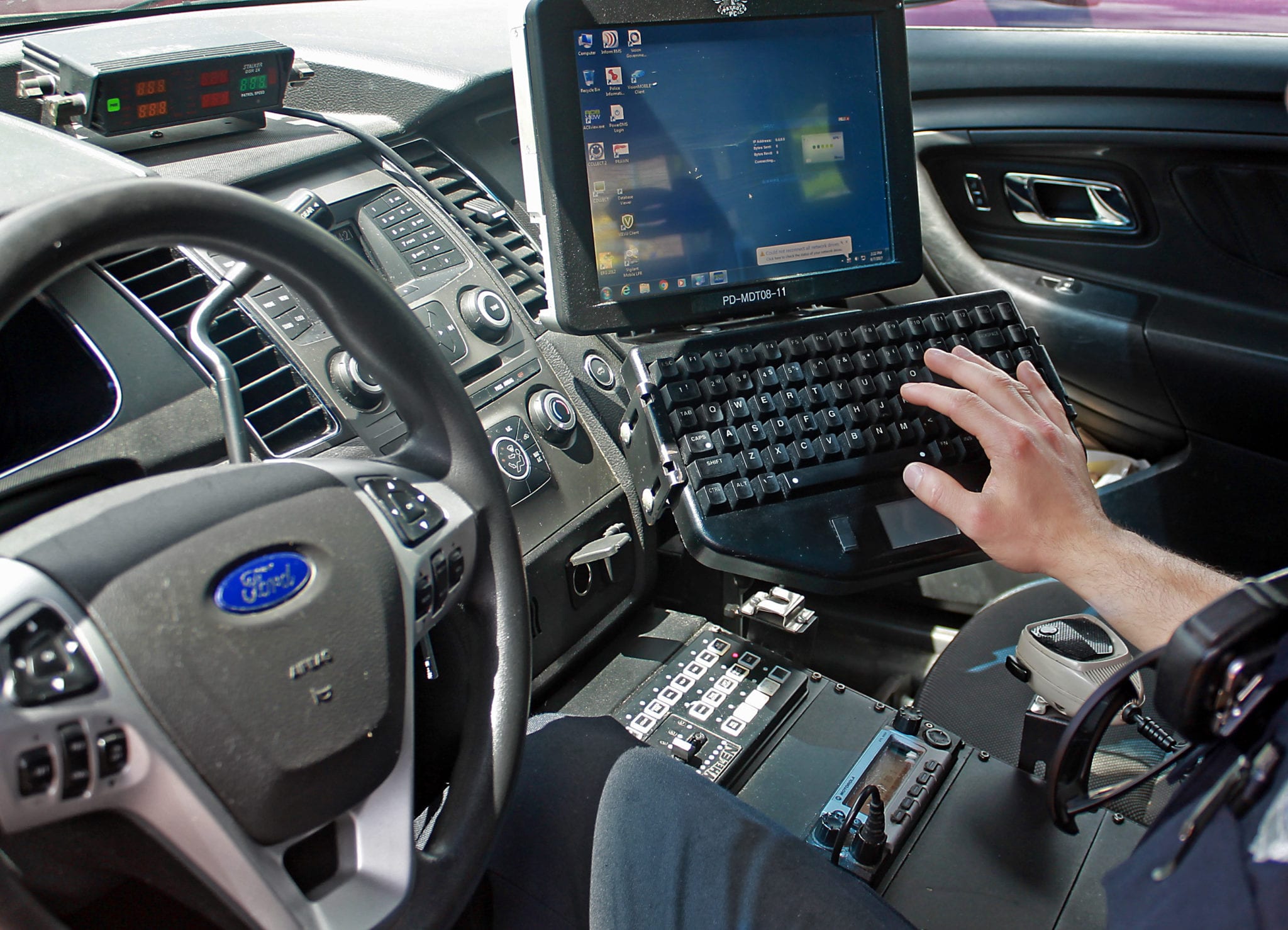 AT&T Fireman using laptop in police car